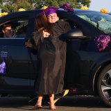 Teacher Jenna Gilbert hugs student Seth Brown.